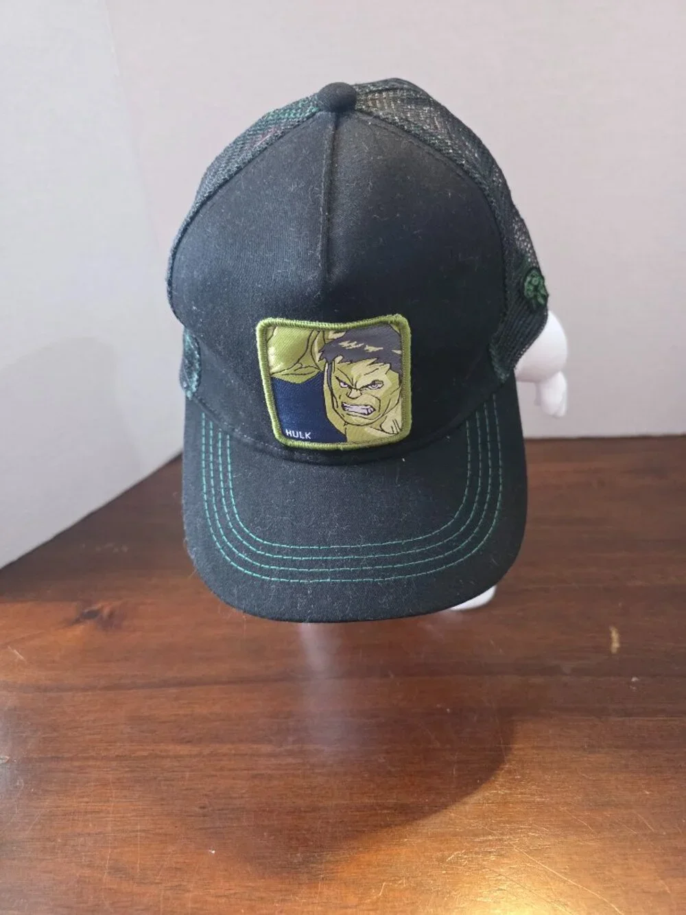 Marvel Comics snapback cap features a black mesh back and a structured front pan